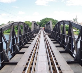 Save Money While Travelling - Walking over The Bridge over The River Kwai in Kanchanburi